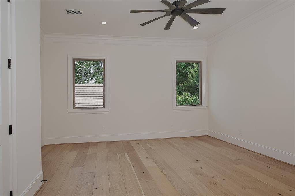 One of the upstairs guest bedrooms - all feature spacious walk-in closets and en-suite baths.