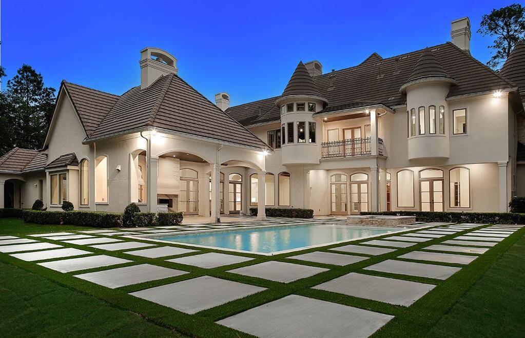 Enhanced with lighting, the back of the home is as gorgeous as the front.