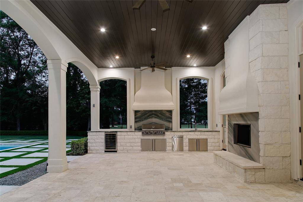 All new appliances in the outdoor kitchen with refaced fireplace and quartzite counters.