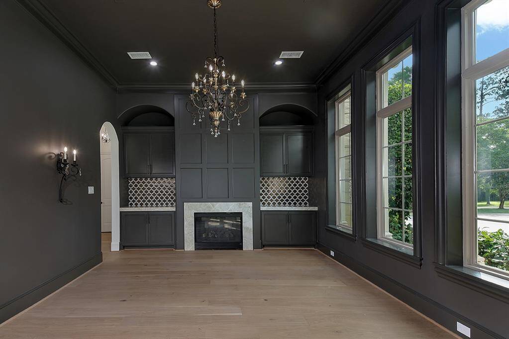 This flex room can be used as a formal dining room with adjacent butler's pantry with wine chiller, or a cool and moody receiving room for guests.