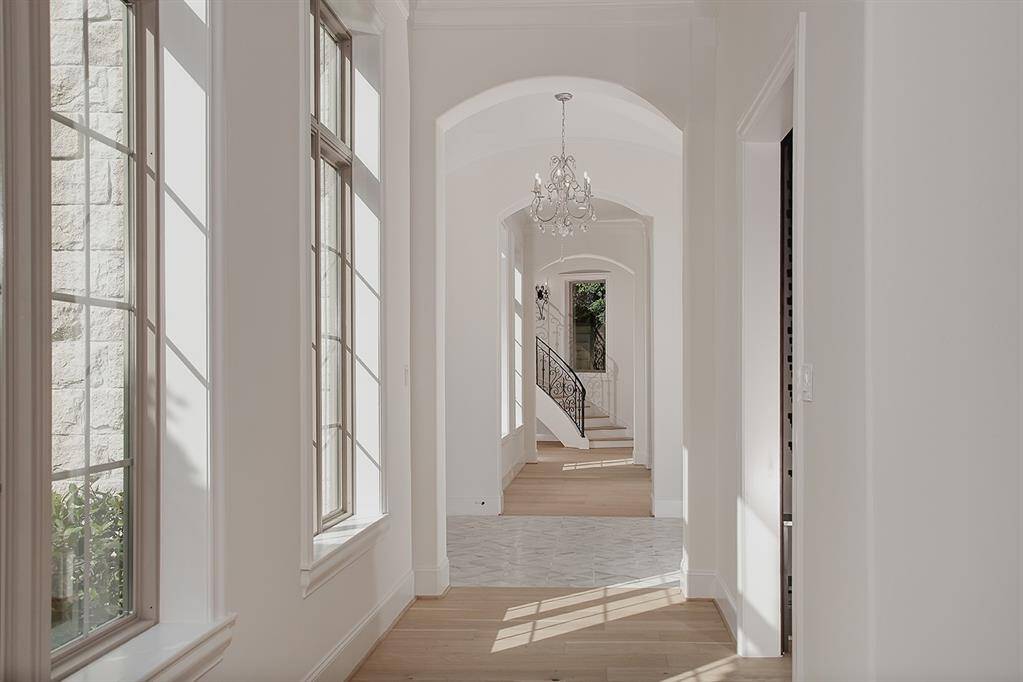 Wide plank French oak hardwood floors, all new windows that bathe the home in natural light, designer light fixtures and fresh interior paint are just a few highlights of this remarkable home.