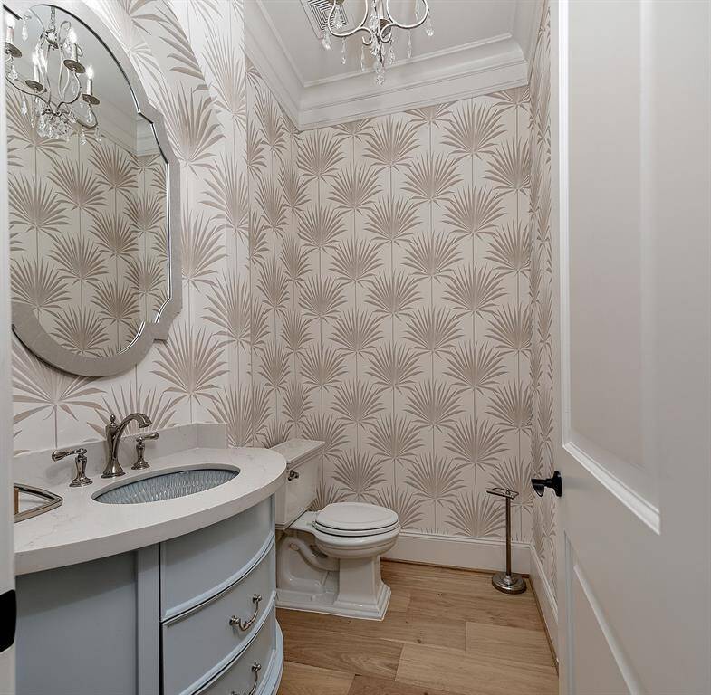 This guest bath is centrally located in the home near the downstairs guest suite.