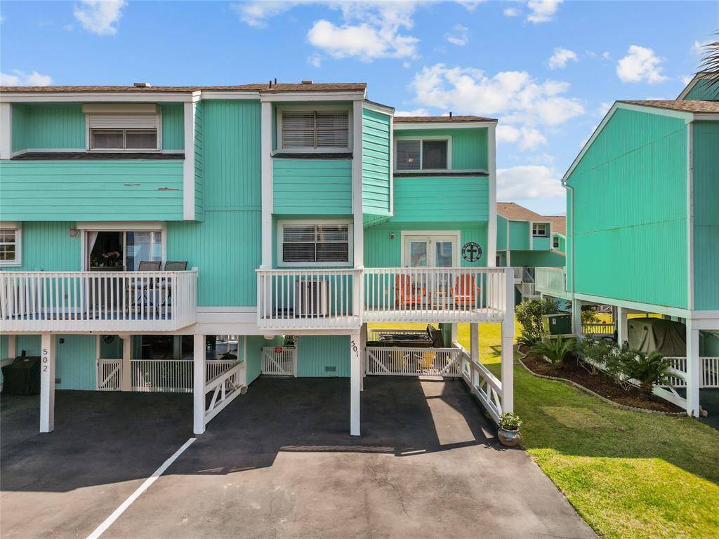 501 Jean Lafitte 2 covered car port spaces, fenced entry, hot tub to the right. Deck off kitchen/Living area.