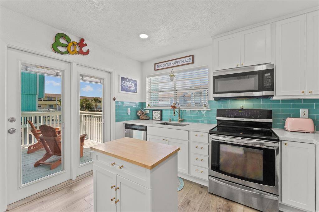 Kitchen with sliding door to deck.