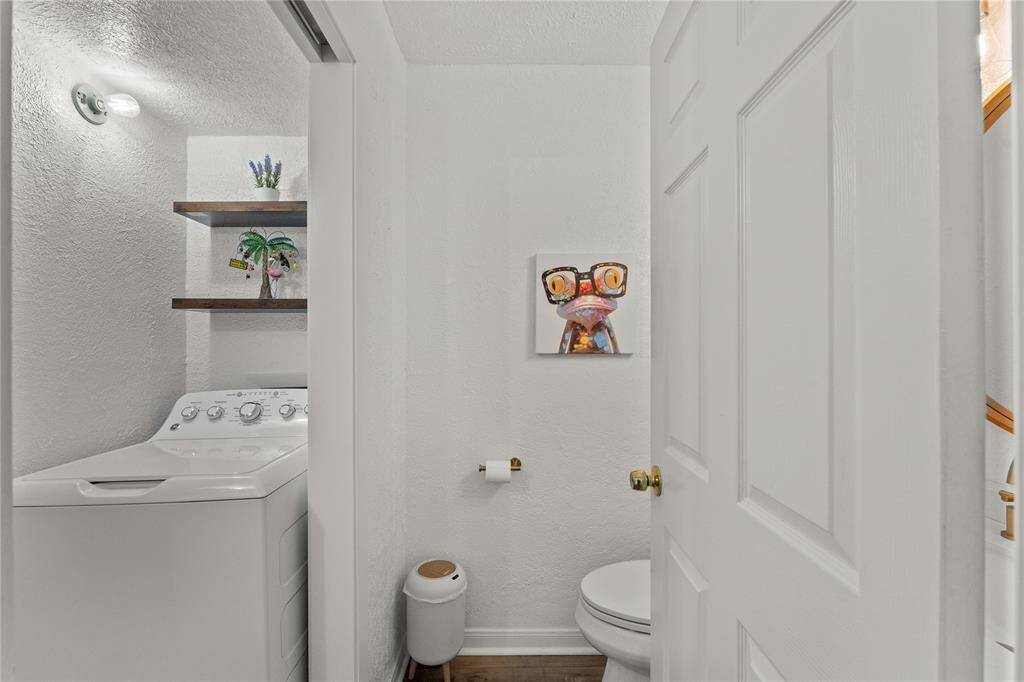 Utility and 1/2 bath down