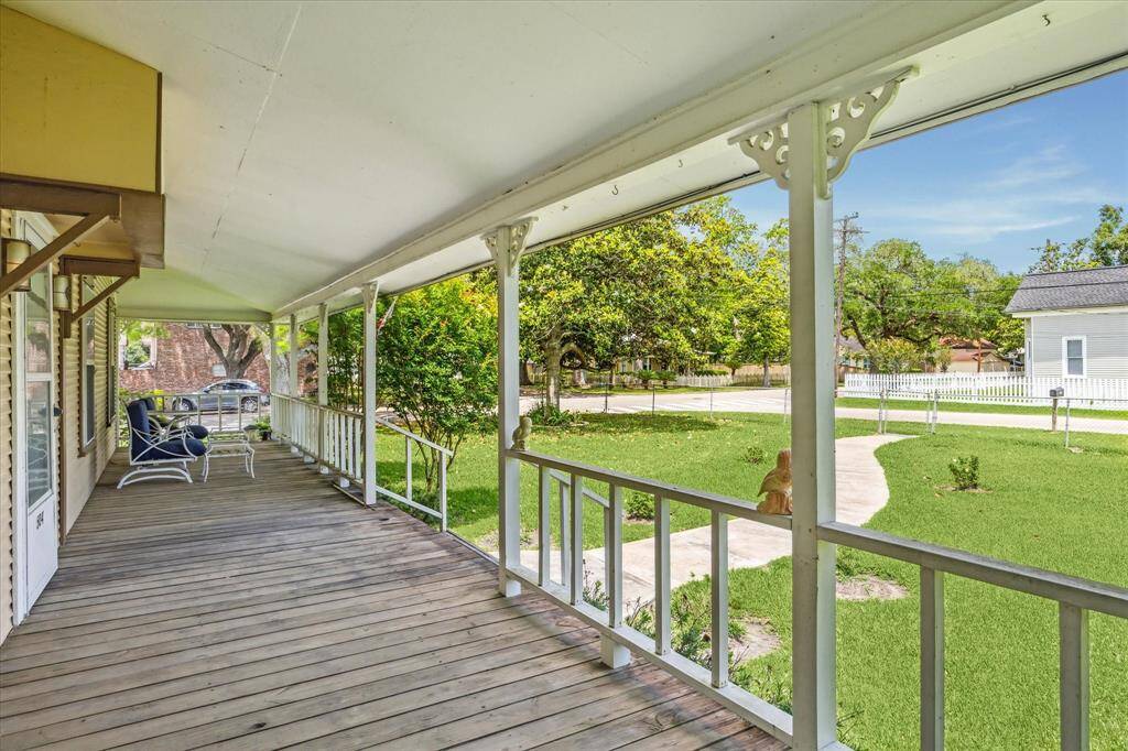 Spacious and beautifully maintained, the side porch is the perfect spot to relax and take in the peaceful surroundings.