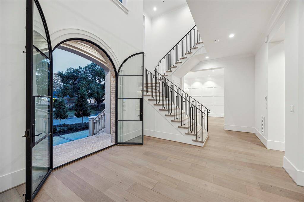 As you walk through the custom, steel front doors you will be instantly wowed by the fine white oaks floors, the pristine white walls, stunning iron bannister and the high ceilings. Just wait for the view!