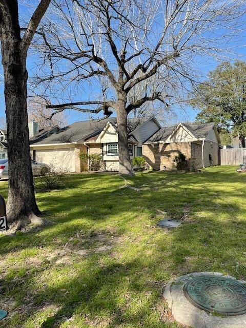 Charming single-story home nestled in a serene neighborhood, featuring a spacious front yard with mature trees and a welcoming facade. Perfect for those seeking a peaceful retreat.