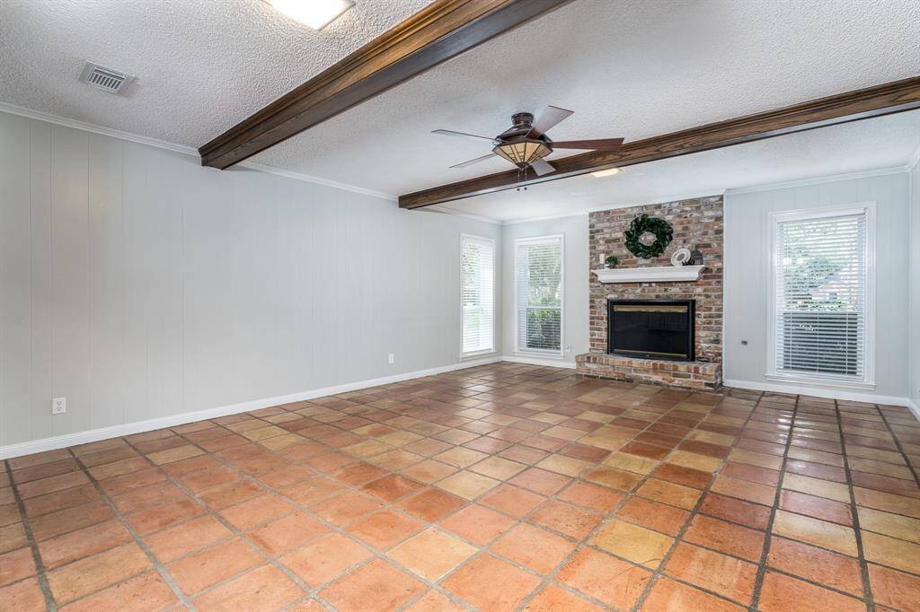 Cozy gas fireplace anchors the main entertaining space.