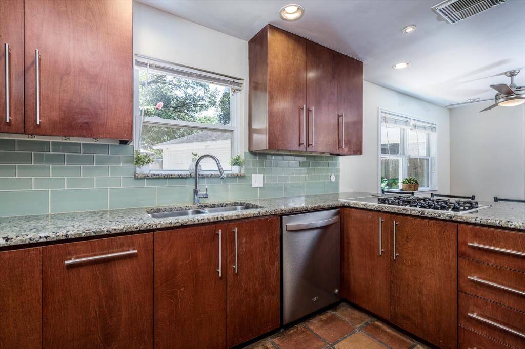 Updates include cabinets, hardware, fixtures, backsplash, granite and more!