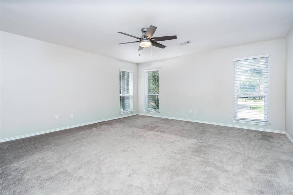 Primary bedroom is immense with plenty of room for a sitting area in addition to a king sized bed.