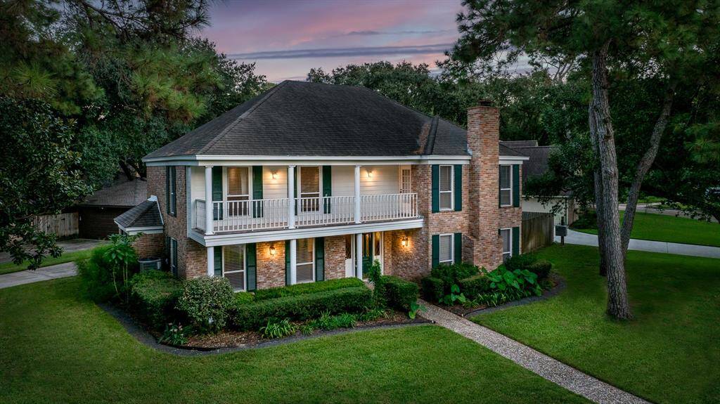 Stately Huntwick home with extensive updates in the most charming of settings.