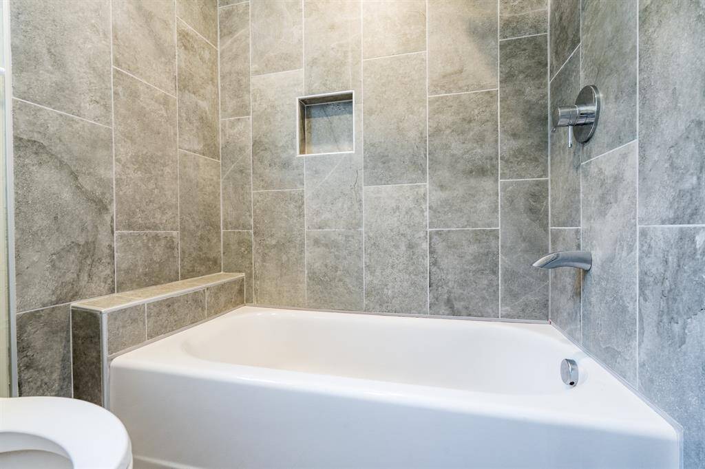 Remodeled shower in the second full bath.