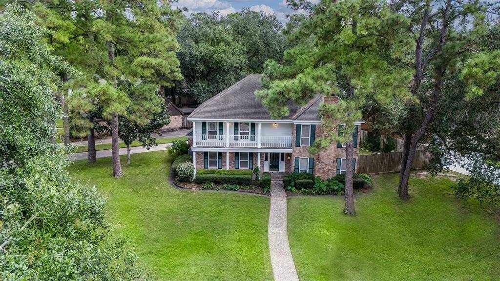 The curb appeal is outstanding amongst mature trees and well set back on an interior street.