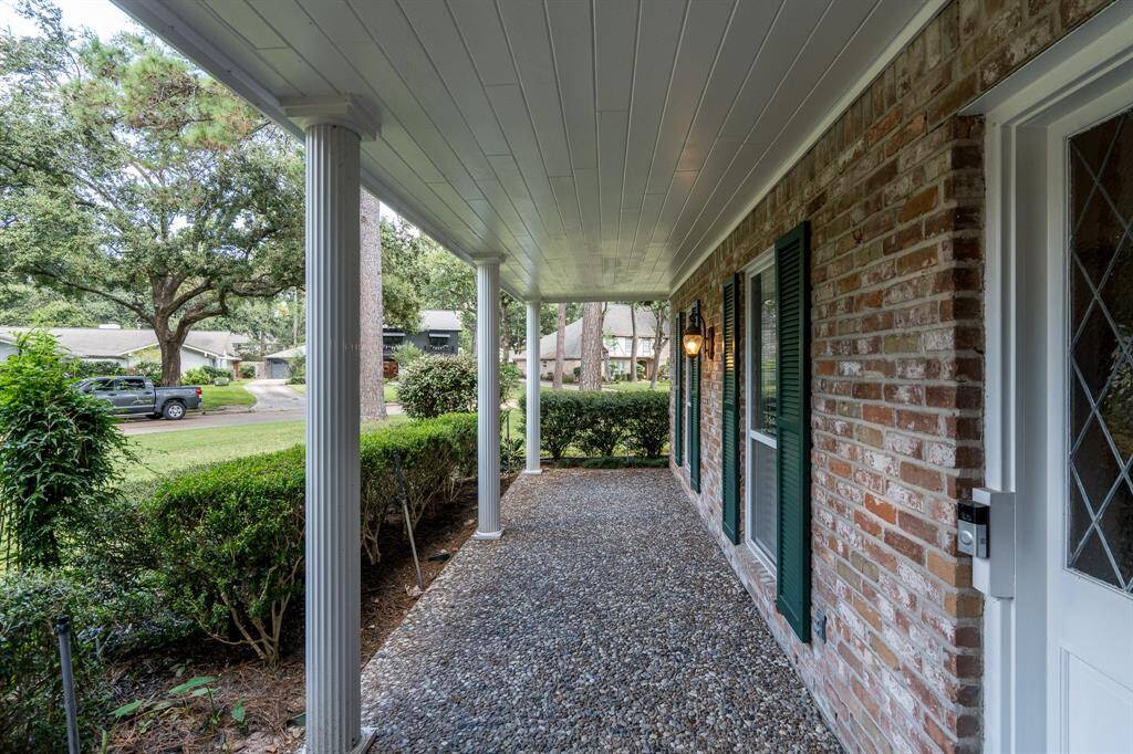 Enjoy the quiet neighborhood views from the large covered front porch.