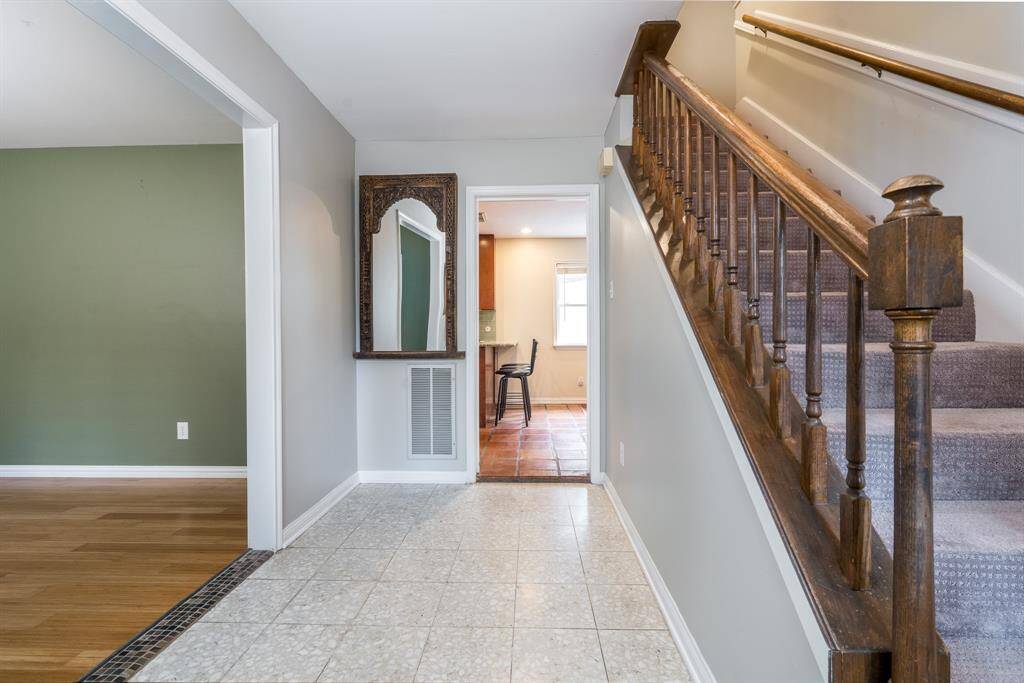 The beautiful architecture continues inside with custom wood trim and banister.