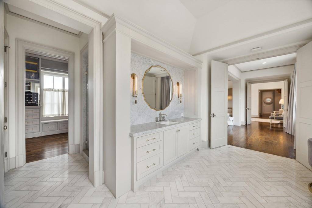 Bright and spacious bath with extra vanity space and direct access to the walk-in closet.