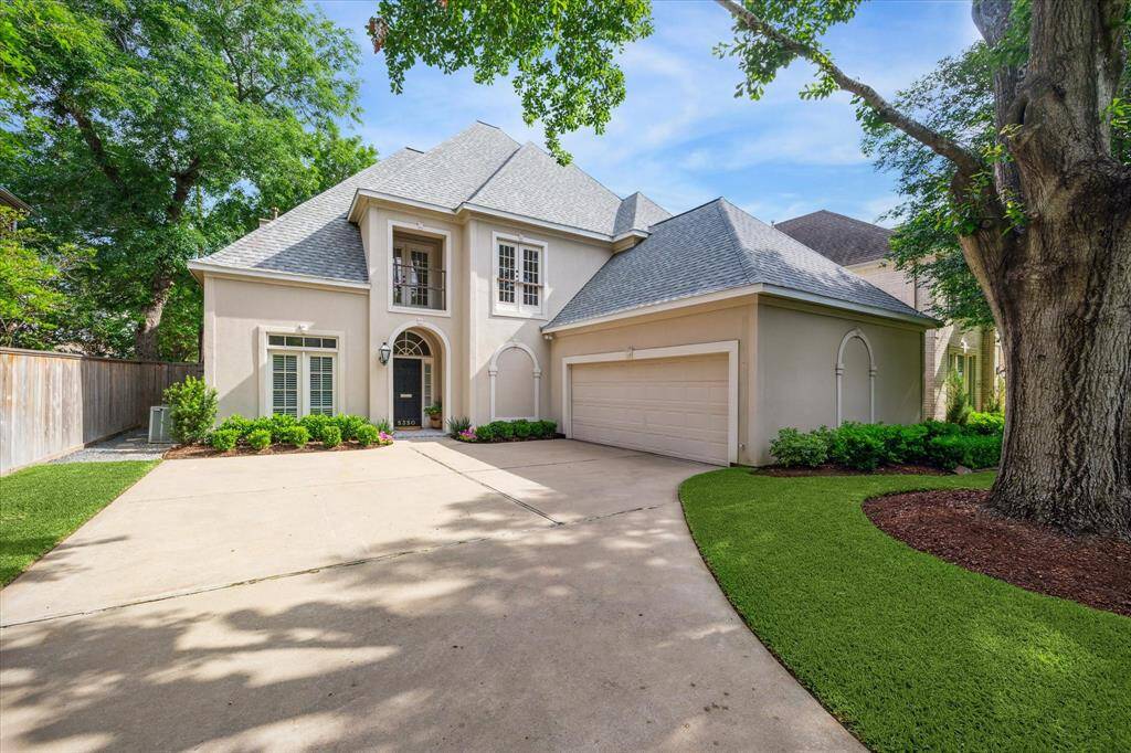 Nestled on a tree-lined street, this beautifully manicured lot and long driveway create a picture-perfect welcome to 5350 Navarro Street.