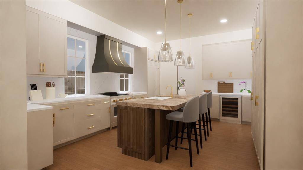 This dream kitchen layout includes a large island, statement range hood, and wine fridge—perfect for both entertaining and everyday living. Rendering provided by custom home builder to show renovation potential.