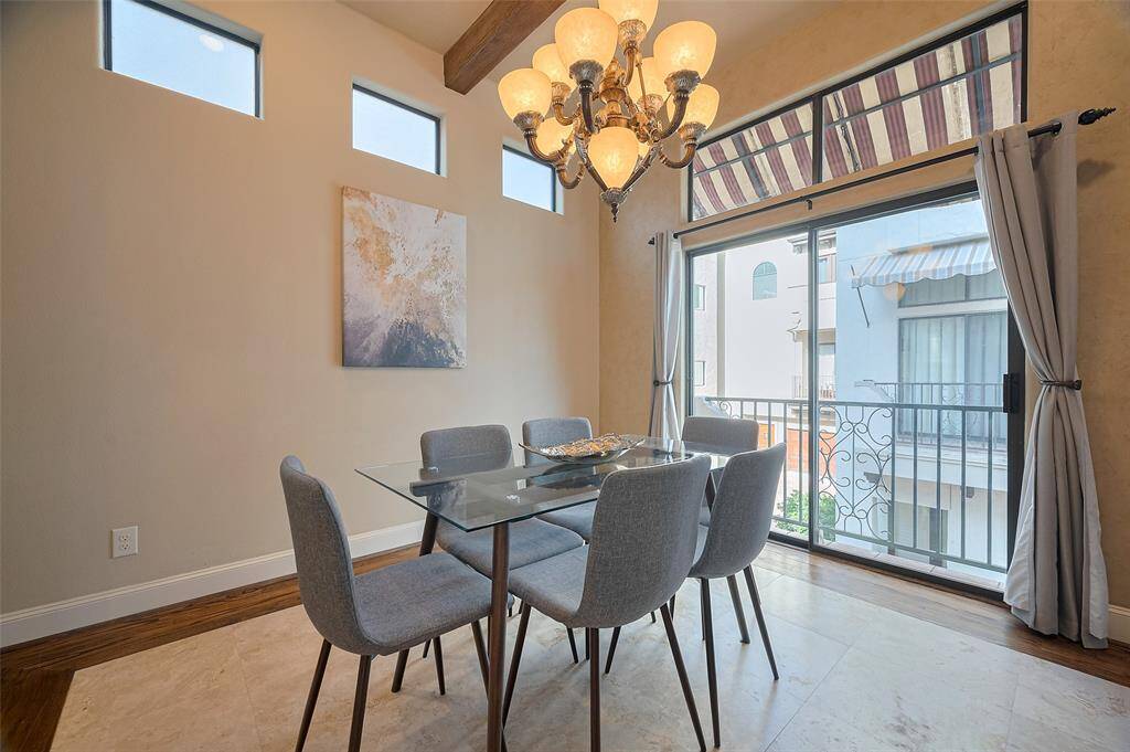 Dining room that leads out to a balcony