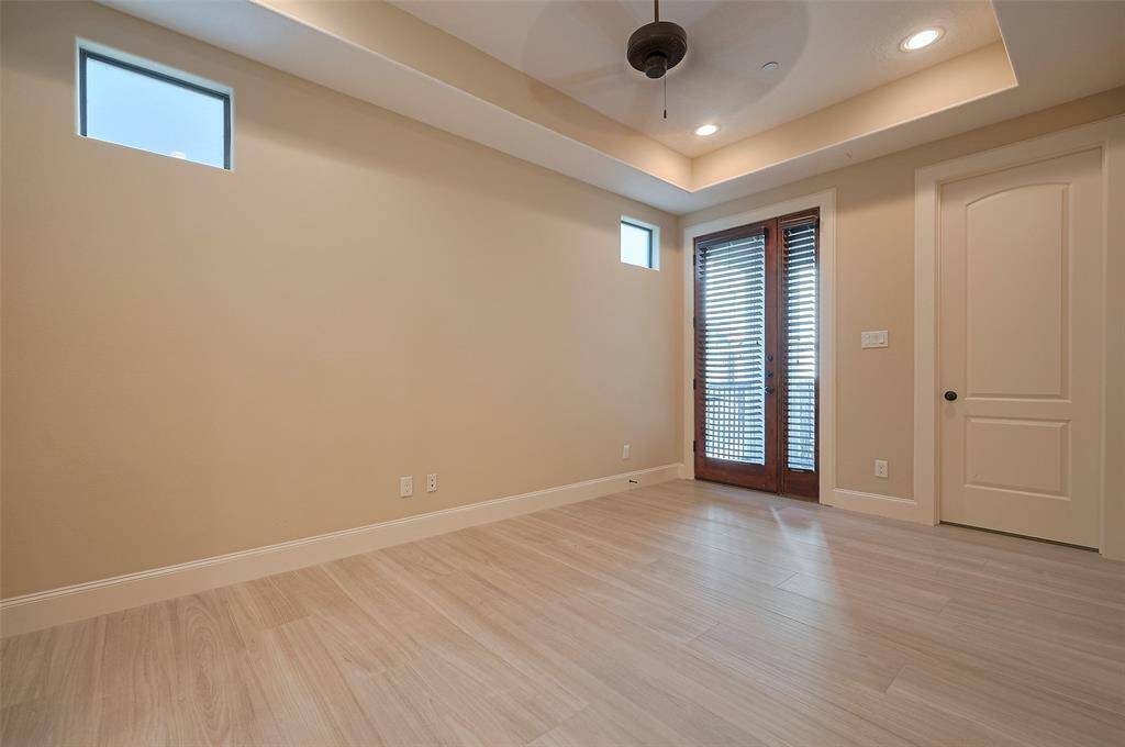 Downstairs Bedroom/Office leads  to an outdoor patio and adjoing bathroom