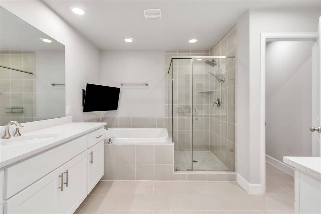 Master bathroom with soaking tub, separate shower and two separate vanities