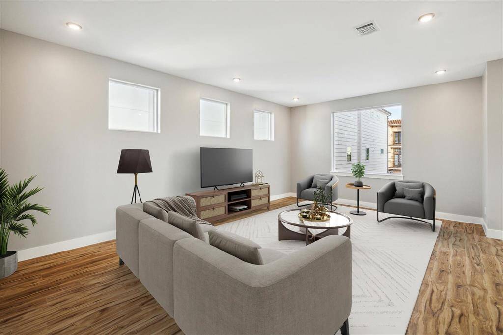 Large living room with abundant windows*This area has been virtually staged