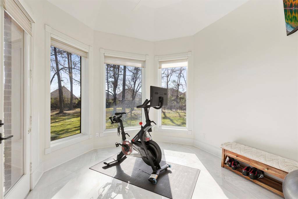 Embrace wellness with a view! This flex space off the primary bathroom is the prefect space for a fitness alcove, perfectly poised for early morning pedal-powered adventures. With panoramic views that might just inspire your inner Tour de France champion, this bright space merges tranquility with motivation, ensuring your daily workout feels more like a rejuvenating escape than a chore.