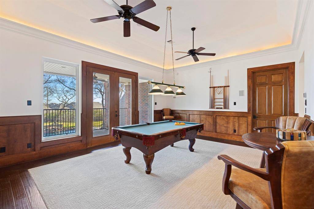 Your own personal billiards haven, game room, or library, where the warmth of rich wood paneling meets the allure of elevated leisure. This game room, complete with scenic views and access to the Juliet balcony, promises hours of enjoyment and occasional whispers of victory.