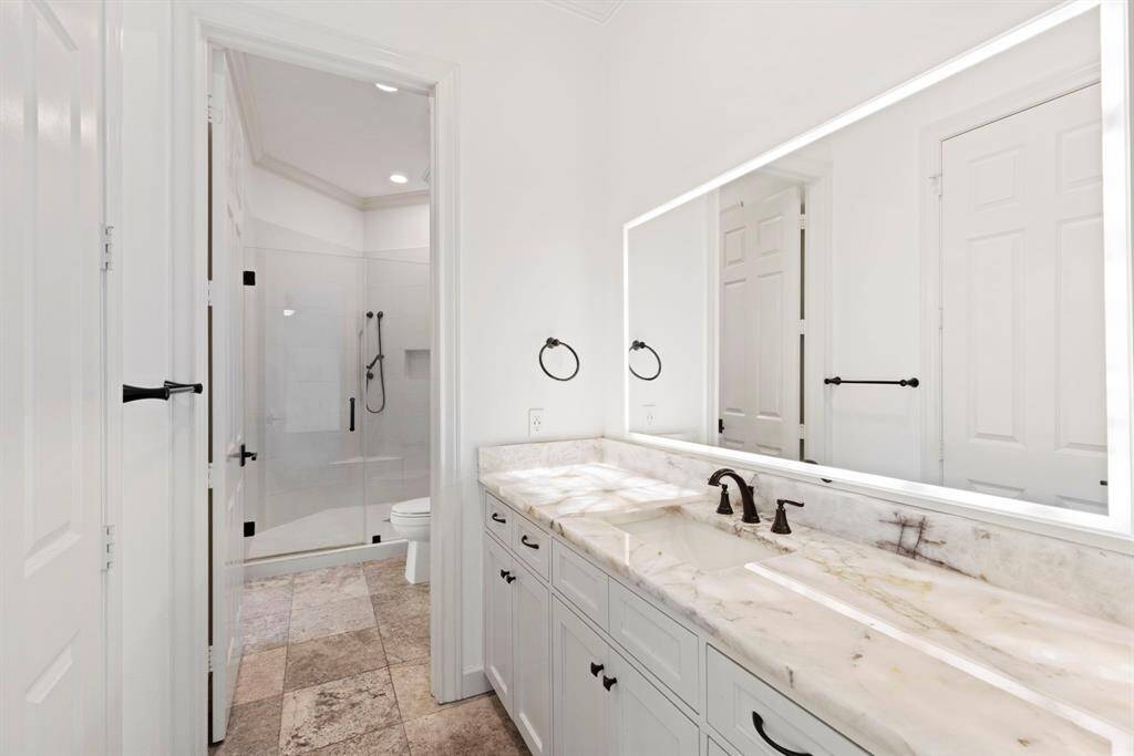 Prepare to be whisked away by the calming allure of this upstairs bathroom, making every morning routine a rejuvenating escape from the ordinary.