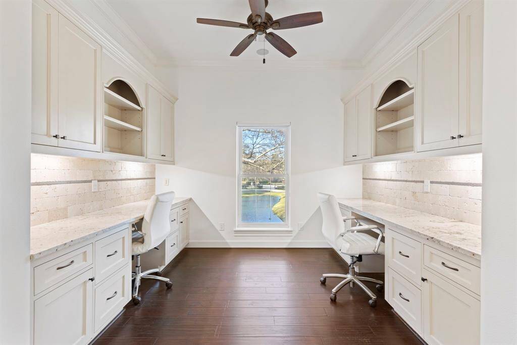 Productivity paradise, with this second story dual-workspace with ample cabinetry and countertop space to inspire creativity.
