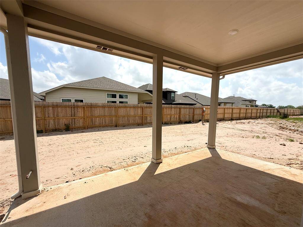 This covered patio isn’t just an extension of your home; it’s a place where you can truly connect with nature and the people you love.