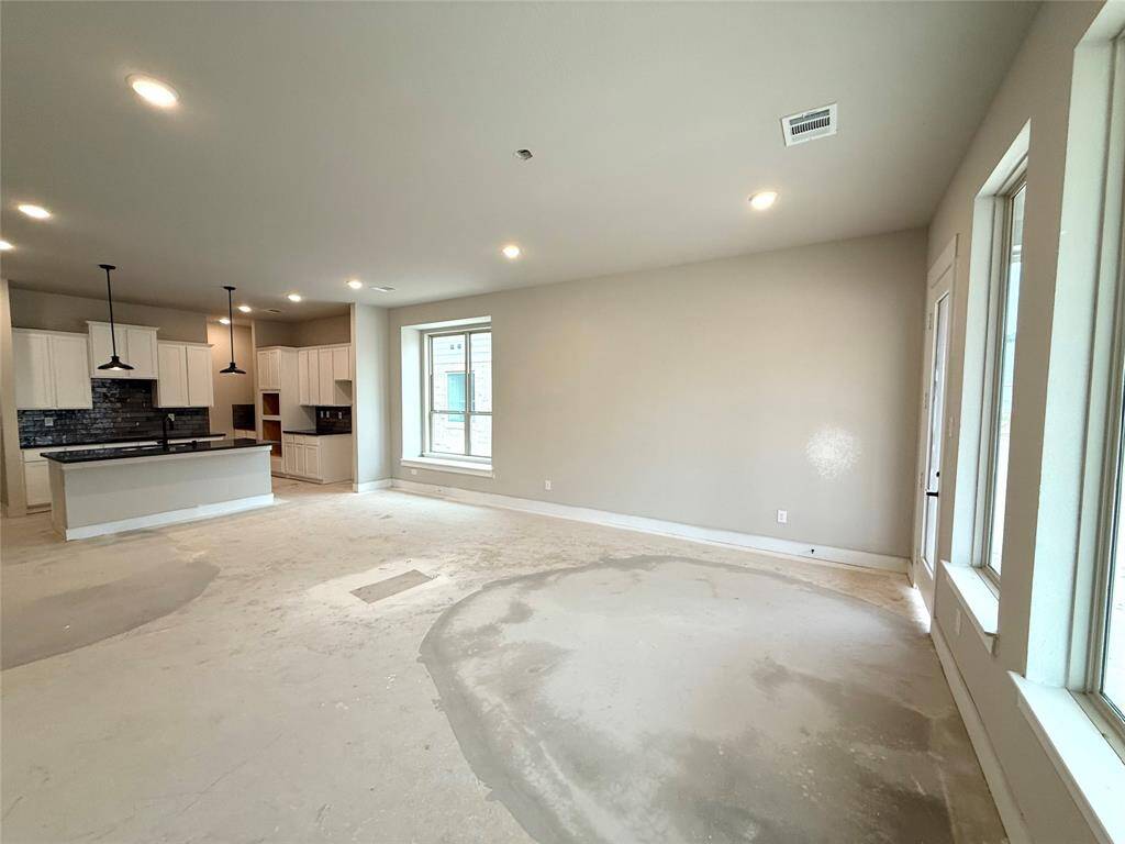 As you wander through the open floor plan, you’ll notice high ceilings that elevate the ambiance, while carefully chosen materials add a touch of luxury without losing that cozy feel.