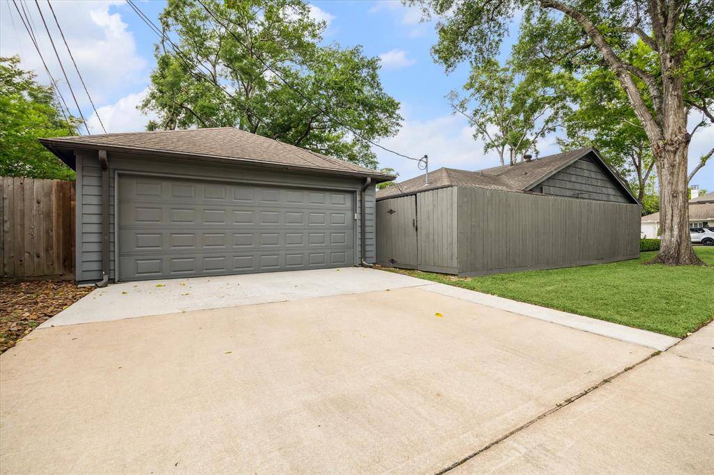 Oversized 2 car garage with work area, storage closet and 300 sf of floored storage above.