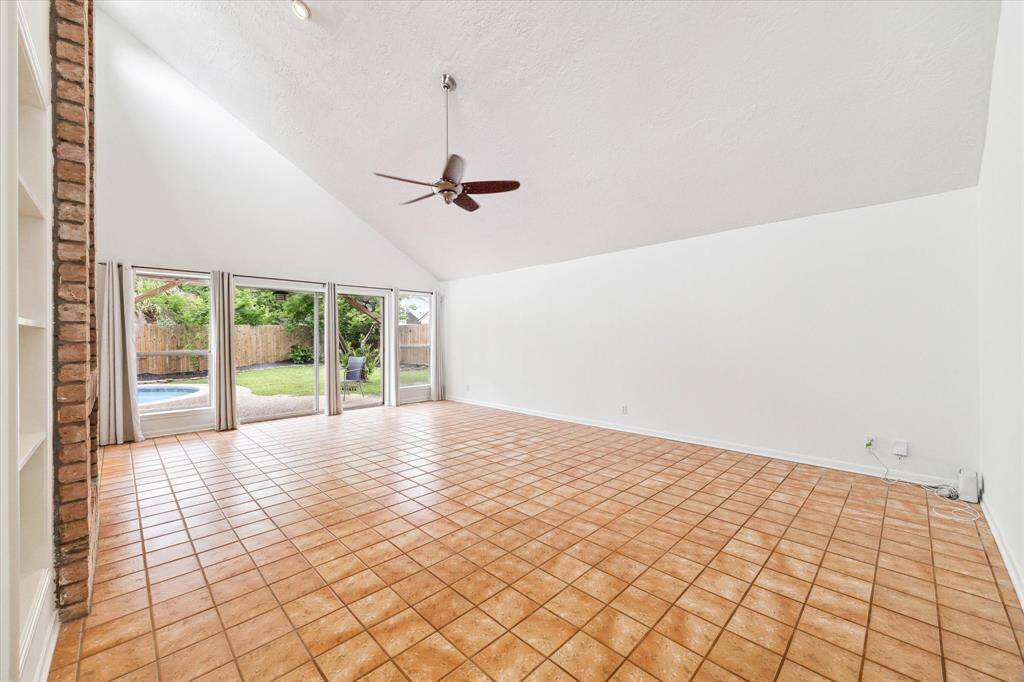 Beautiful windows and sliding door showcasing pool in backyard.