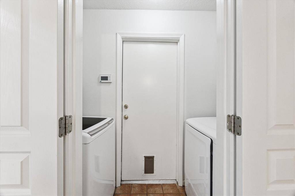 Washer and dryer in laundry room stay! Door leads to garage, GE fridge in garage stays with home.