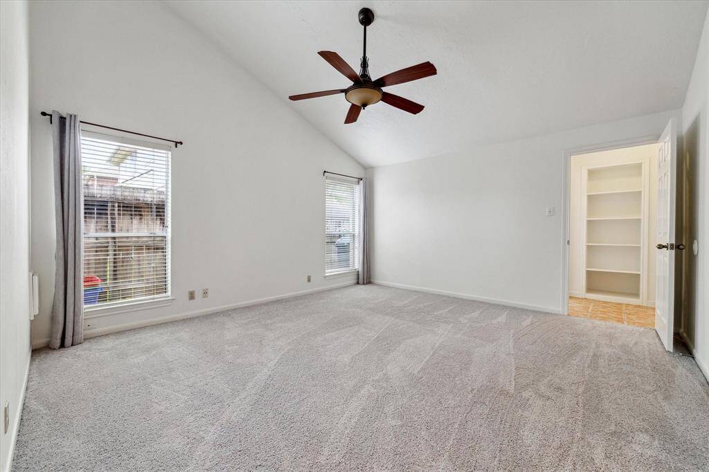 Large primary bedroom with new carpet and large windows!