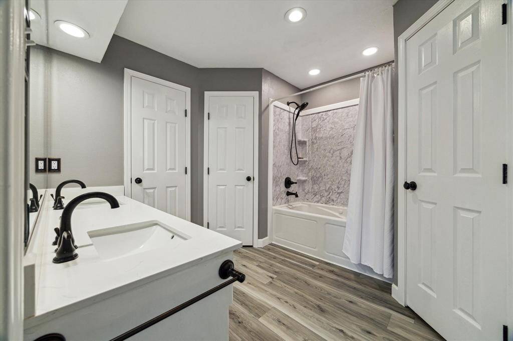 Updated Primary bathroom with 2 double sinks, 2 walk in closets and huge linen closet!