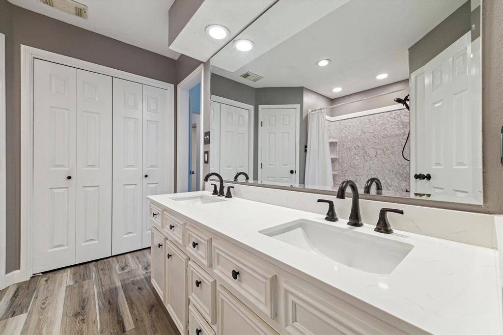 Updated Primary bathroom with 2 double sinks, 2 walk in closets and huge linen closet!