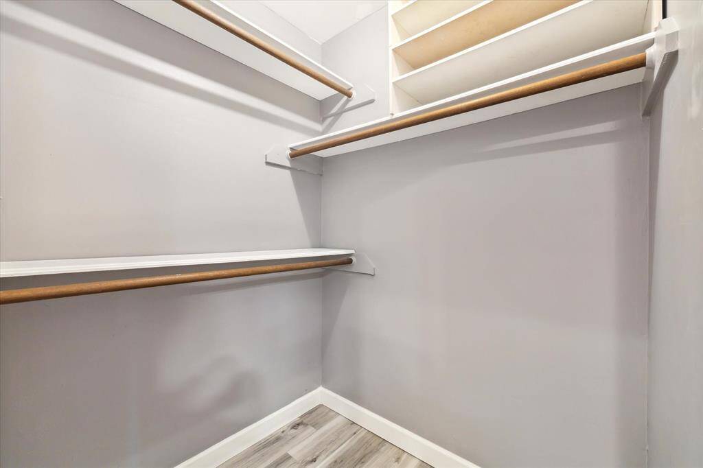 Second primary closet with plenty of storage space.