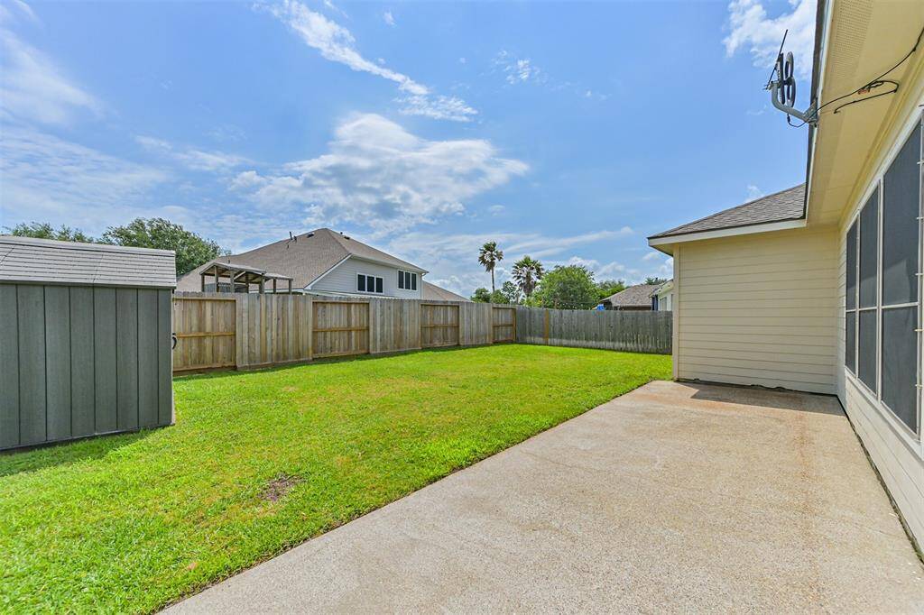 Back patio features oversize concrete pad that wraps around house - storage building stays with house!