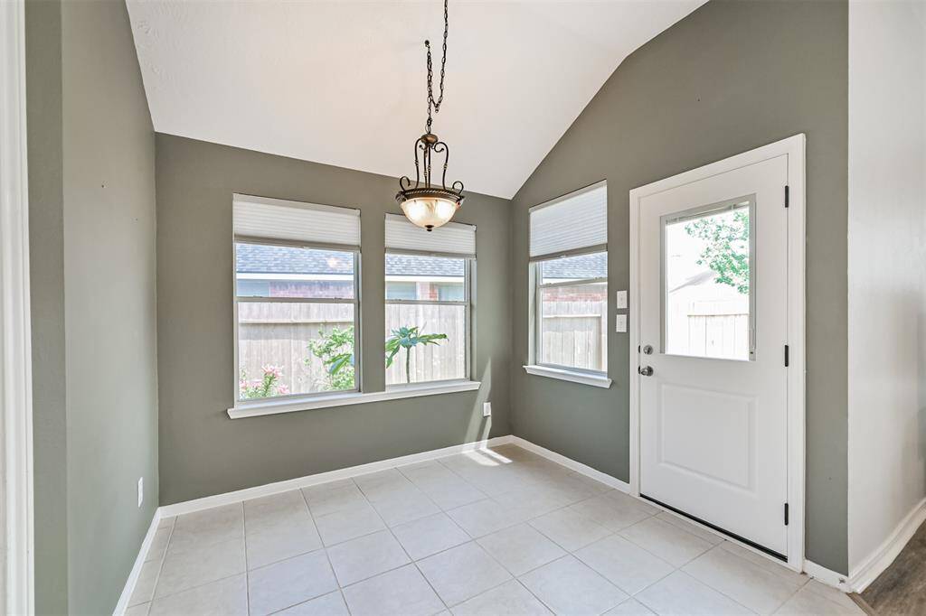 Breakfast nook just off kitchen with access to oversized back patio