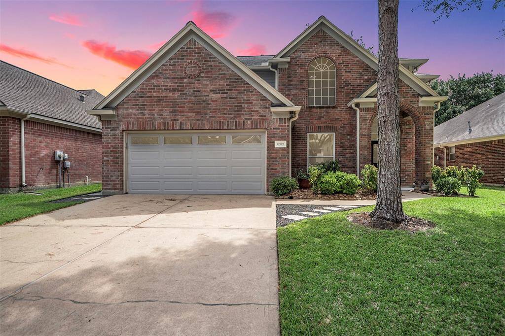 Welcome home to charming curb appeal with a spacious double driveway offering ample parking and convenience. Two large, mature trees anchor the front yard, providing shade and character while creating a picturesque, welcoming atmosphere.