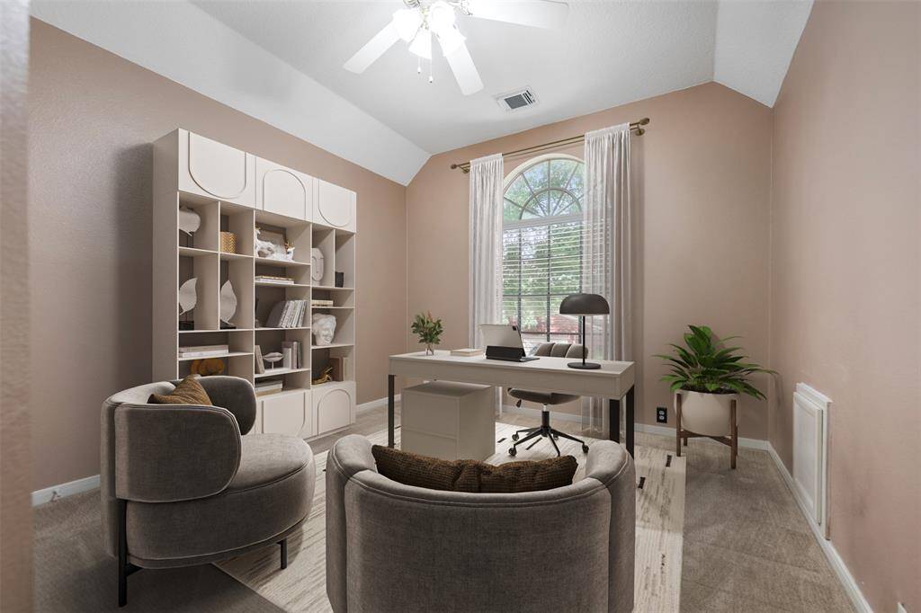 The secondary bedroom offers spacious comfort with large closet space and a charming arched window that overlooks the front yard, filling the room with natural light. This versatile space could easily double as an office, combining functionality with a peaceful, inviting atmosphere. (This photo is virtually staged)