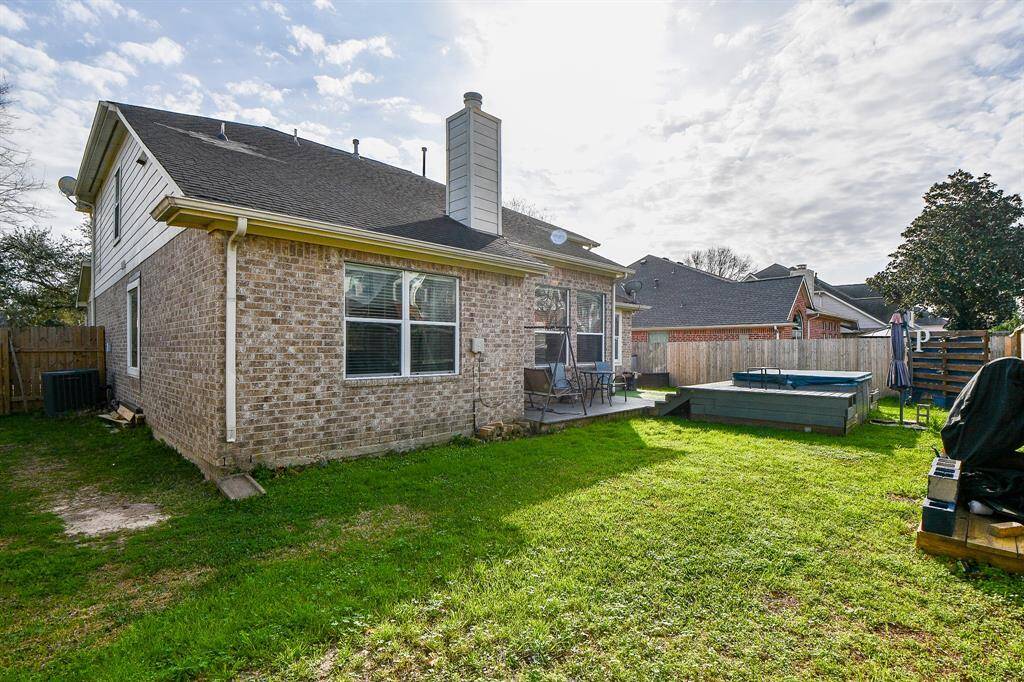 Spacious backyard with a HOT TUB!