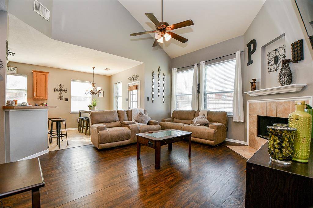 Spacious living room with high ceilings and tons of natural light.