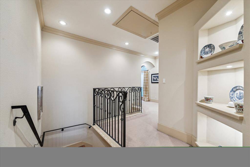 Great detail work throughout this house - from the wrought iron railings, to the raised baseboards and double crown molding throughout to this unique cut-in for art/piece displays.