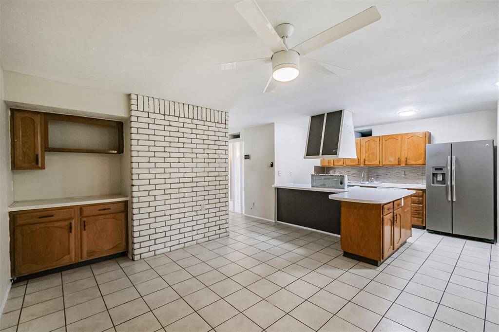 Den area with dry bar and view to the kitchen