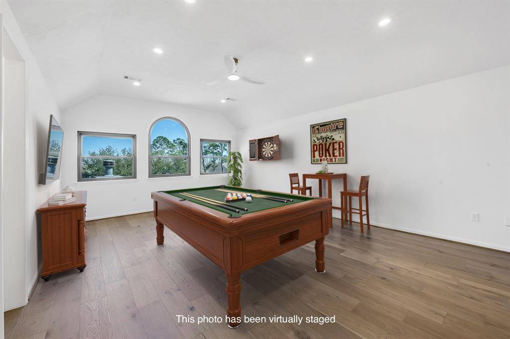 An alternate view of the game room highlights its generous size and open layout. A great hangout space for family and guests!