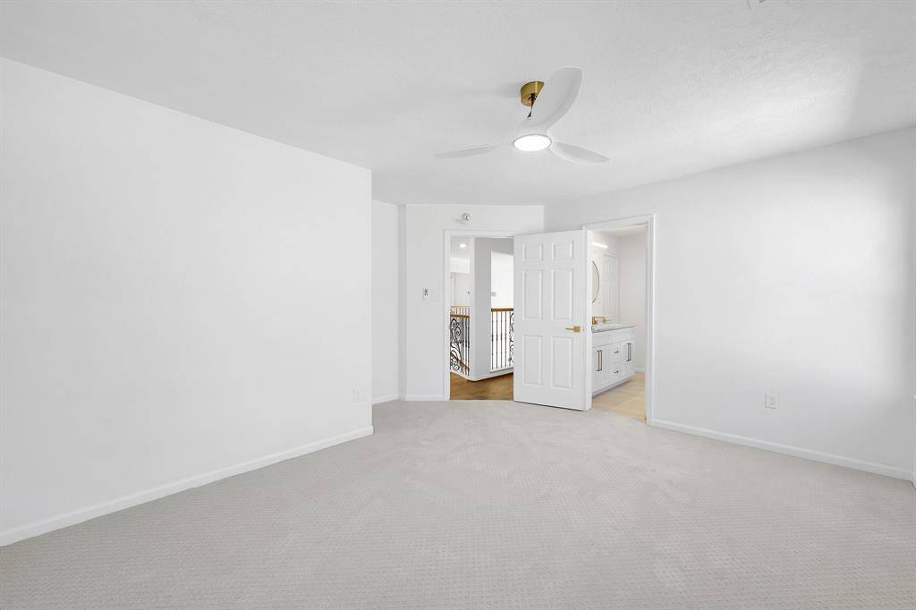 A reverse view shows clean lines and neutral tones make this move-in ready.